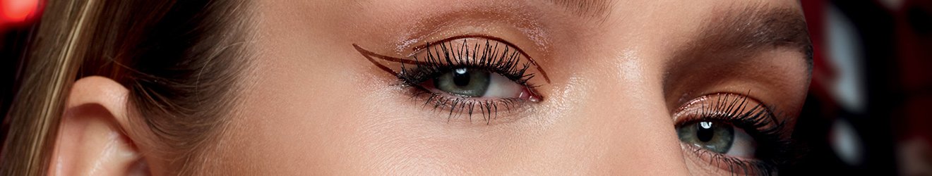 Maybelline Eyeliner products illustrative banner image - Close up of a woman wearing graphic Eyeliner